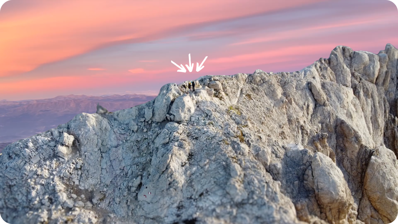 Mat and Angie on top of the Gran Sasso Mountain at the sunrise, after have hiked for 5 hours.