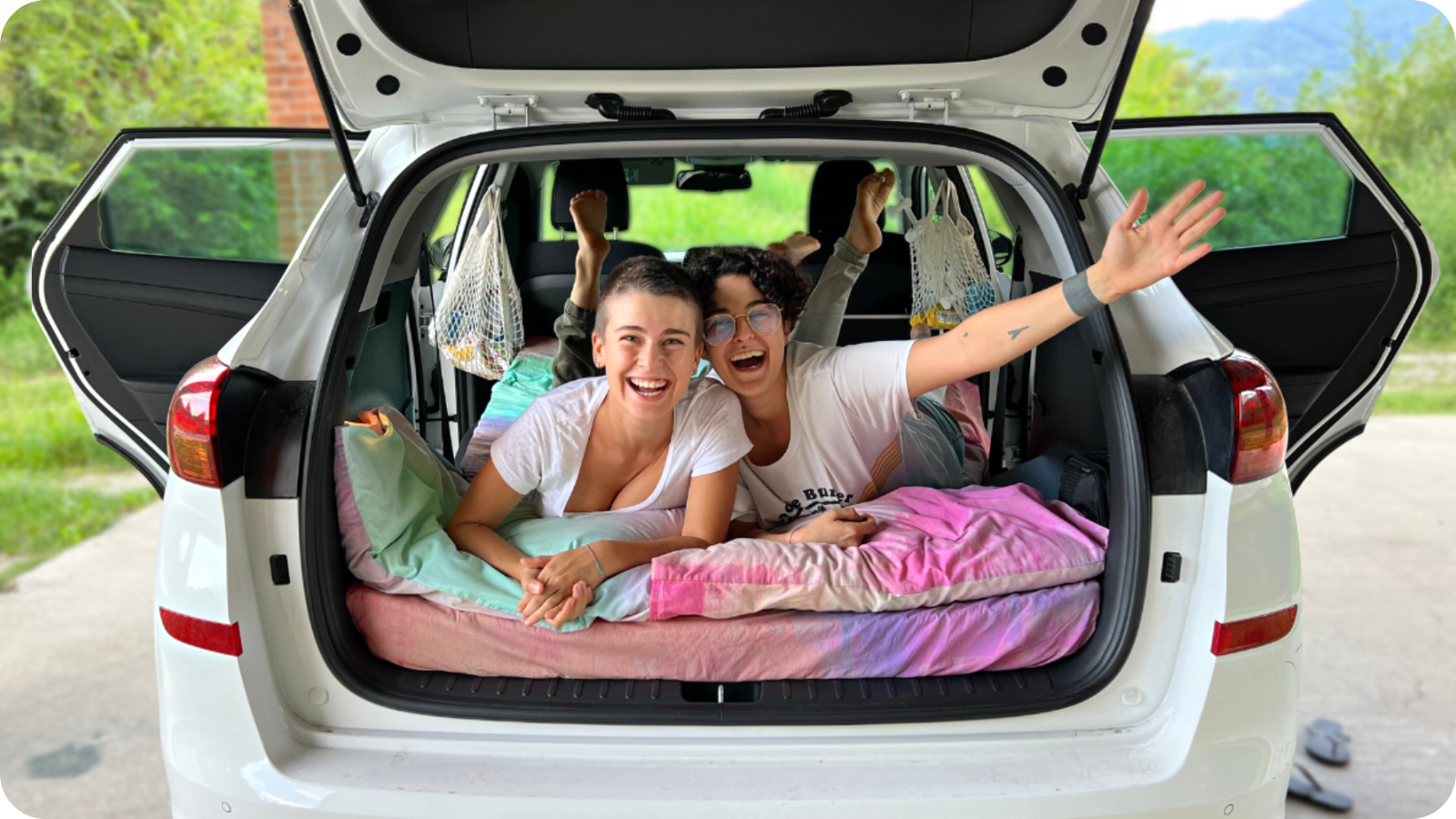 Mat and Angie in the car that they called home for almost two months while road tripping Italy.