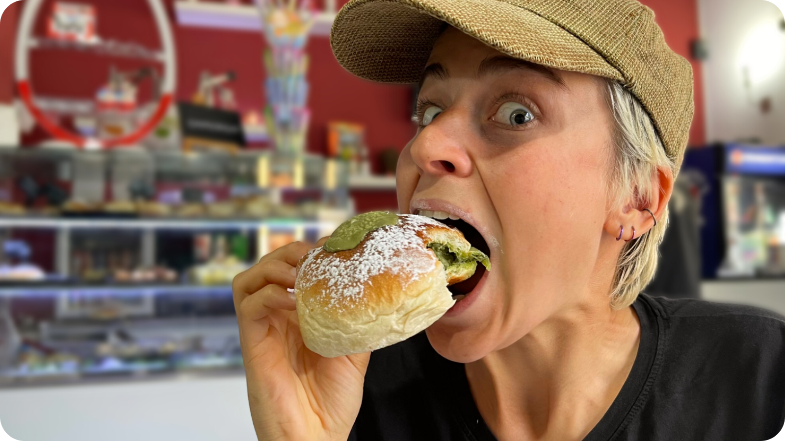 Mat eating a delicious vegan pastry in Palermo, Sicily.